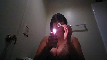 Meth whore smokes in Restroom