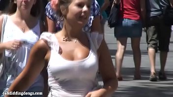 Busty candid teen in a hurry walking down the street, bouncing boobs