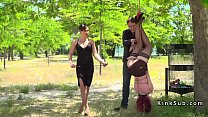 Redhead in stockings suspended in park