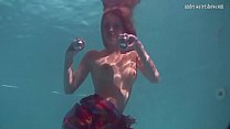 Redhead b. Nikita Vodorezova gets naked fast underwater